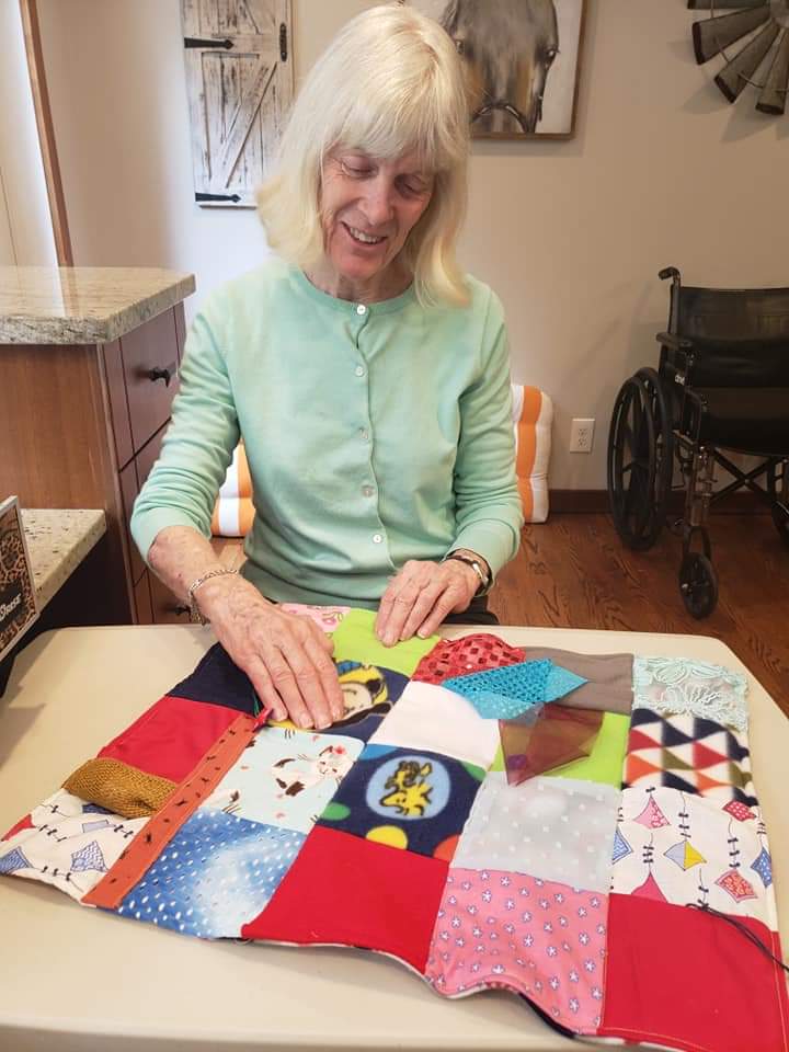 Elder woman doing sewing